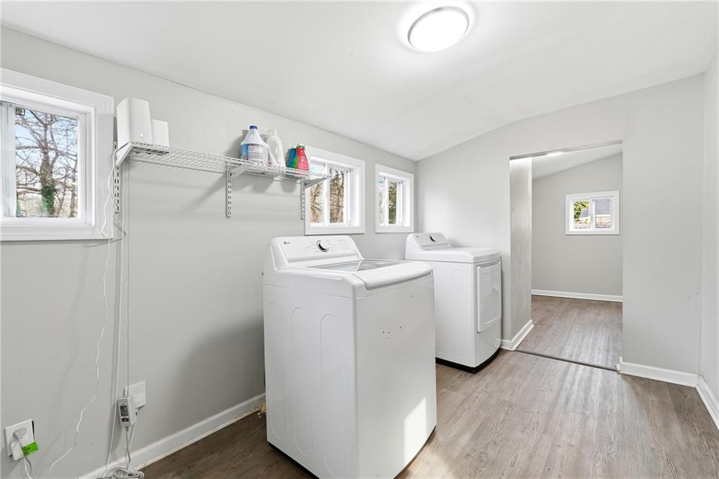 7 Willingham Street Rome, GA 30161 - Photo 21 of 25 a utility room with cabinets washer and dryer