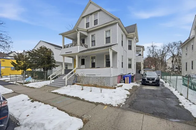 a street view with a building in the background