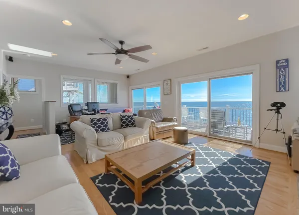 a living room with furniture fireplace and flat screen tv