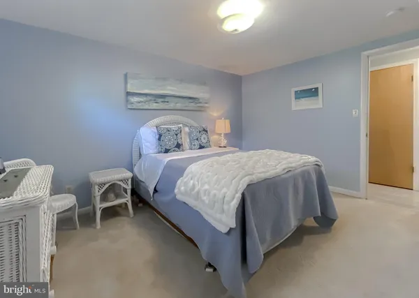 a bedroom with a bed and a table