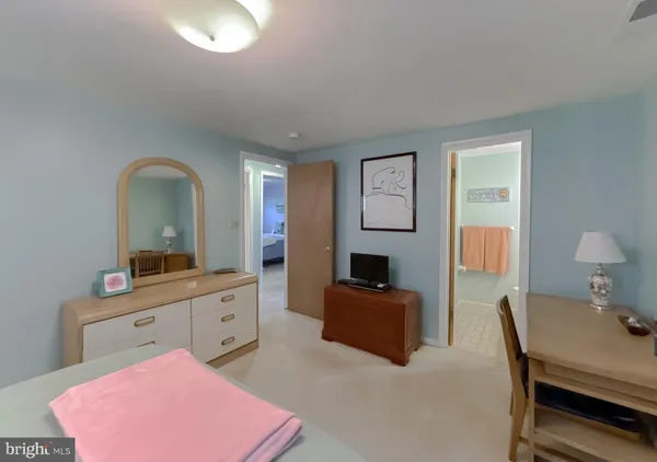 a kitchen with cabinets stainless steel appliances and a window