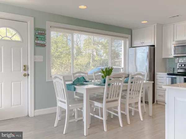 a view of a balcony with wooden floor