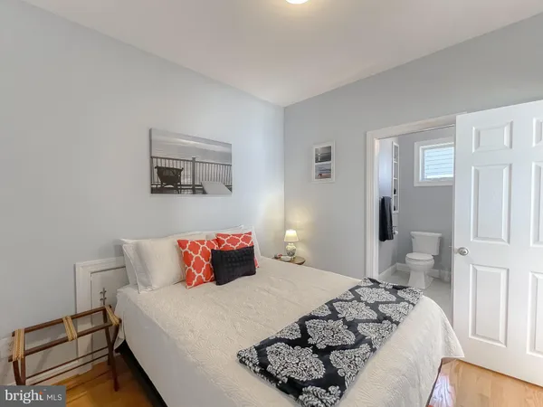 a living room with furniture a rug and a chandelier