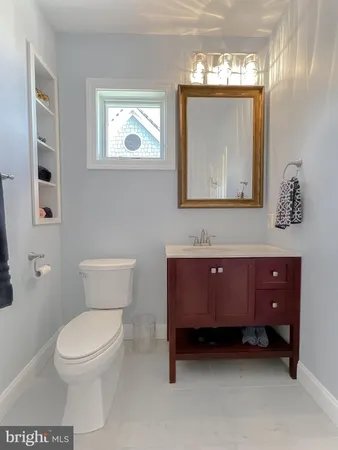 a living room with a fireplace and a flat screen tv