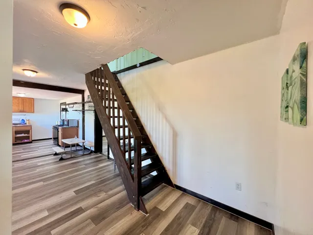 a view of entryway with wooden floor