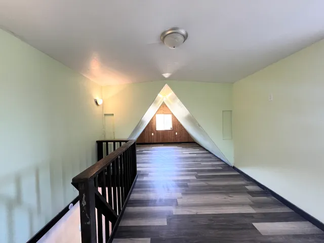 a hallway with wooden floor