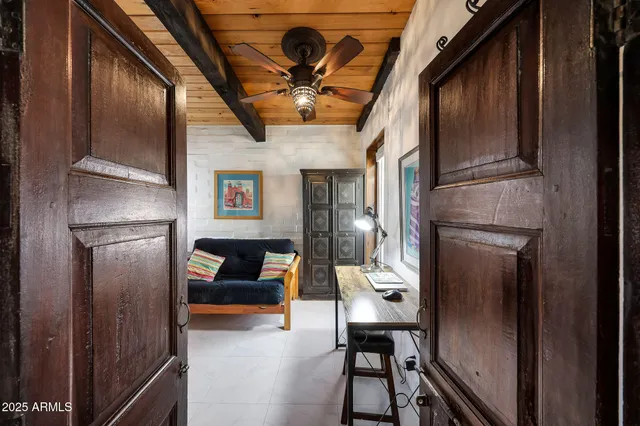 a view of a room with wooden floor