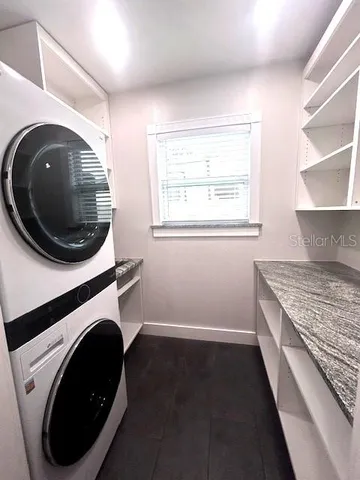 a view of livingroom with washer and dryer