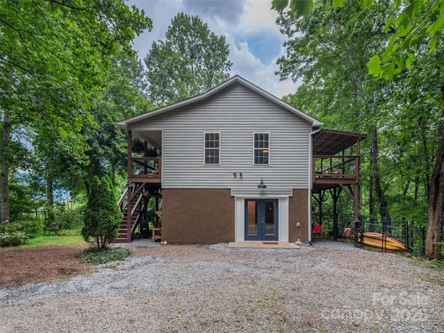 a view of a lush green forest with lots of trees