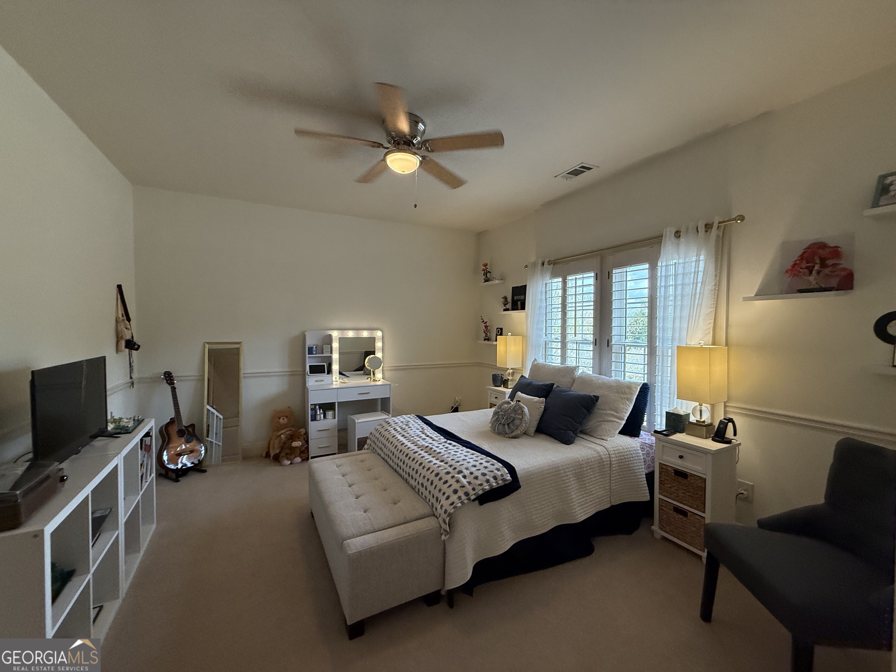 990 Chateau Forest Road Hoschton, GA 30548 - Photo 117 of 117 a bedroom with a bed and a flat screen tv