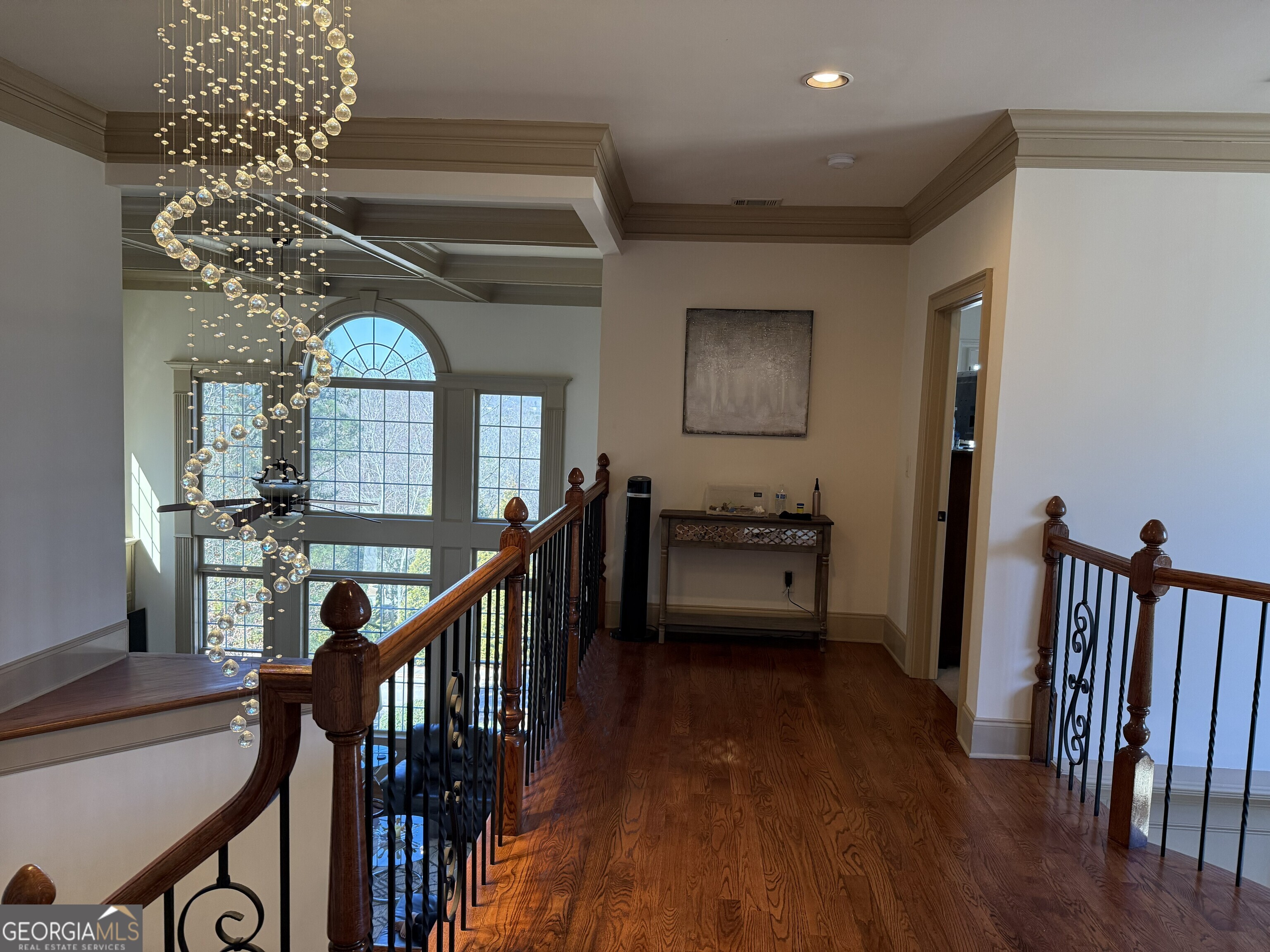 990 Chateau Forest Road Hoschton, GA 30548 - Photo 13 of 117 a view of a livingroom with furniture stairs wooden floor and windows