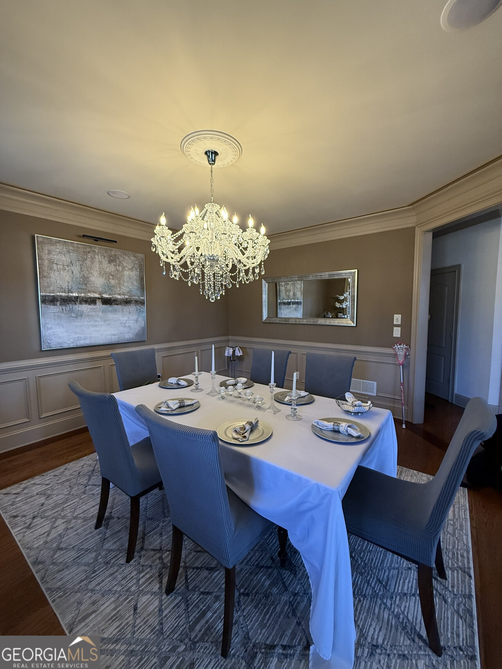 990 Chateau Forest Road Hoschton, GA 30548 - Photo 25 of 117 a view of a dining room with furniture and chandelier