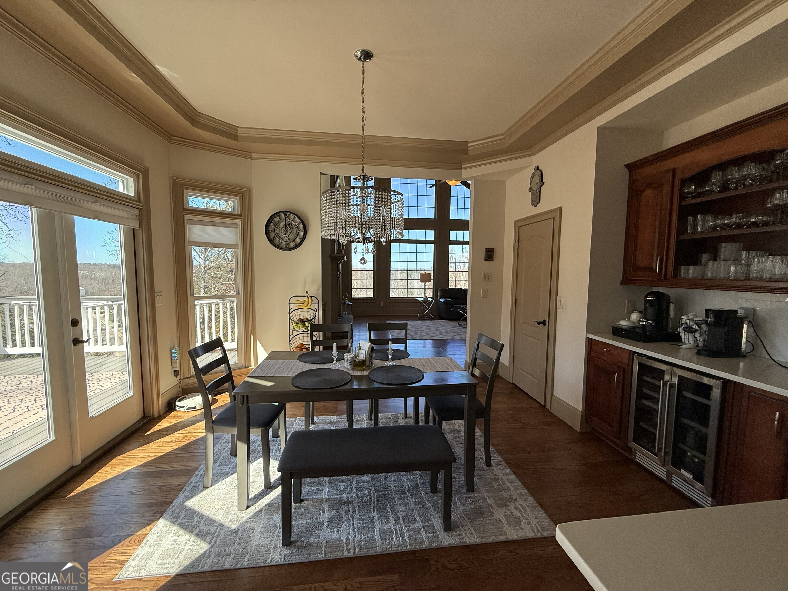 990 Chateau Forest Road Hoschton, GA 30548 - Photo 27 of 117 a view of a dining room with furniture window and wooden floor