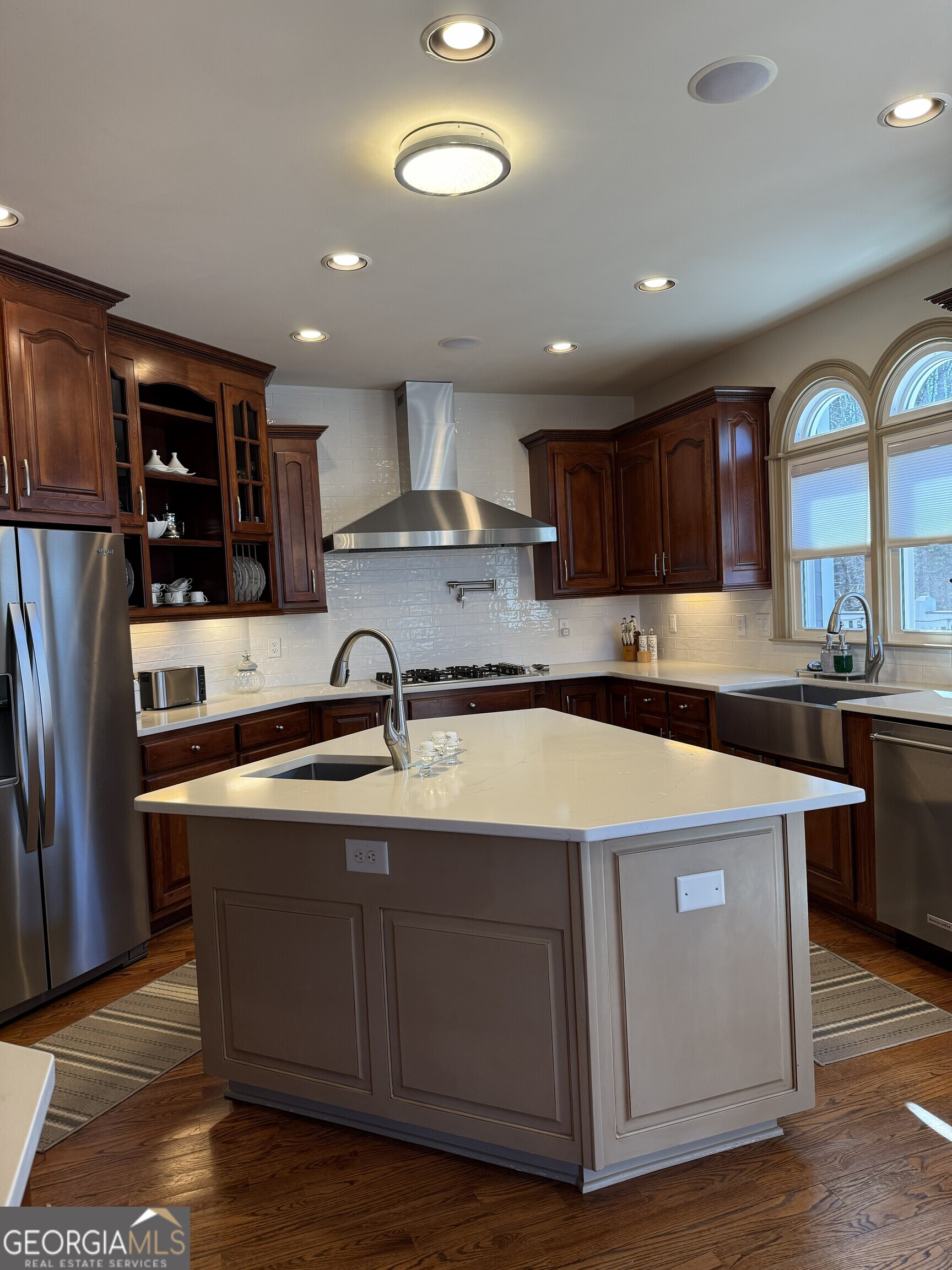 990 Chateau Forest Road Hoschton, GA 30548 - Photo 31 of 117 a kitchen with stainless steel appliances granite countertop a sink a stove and a refrigerator
