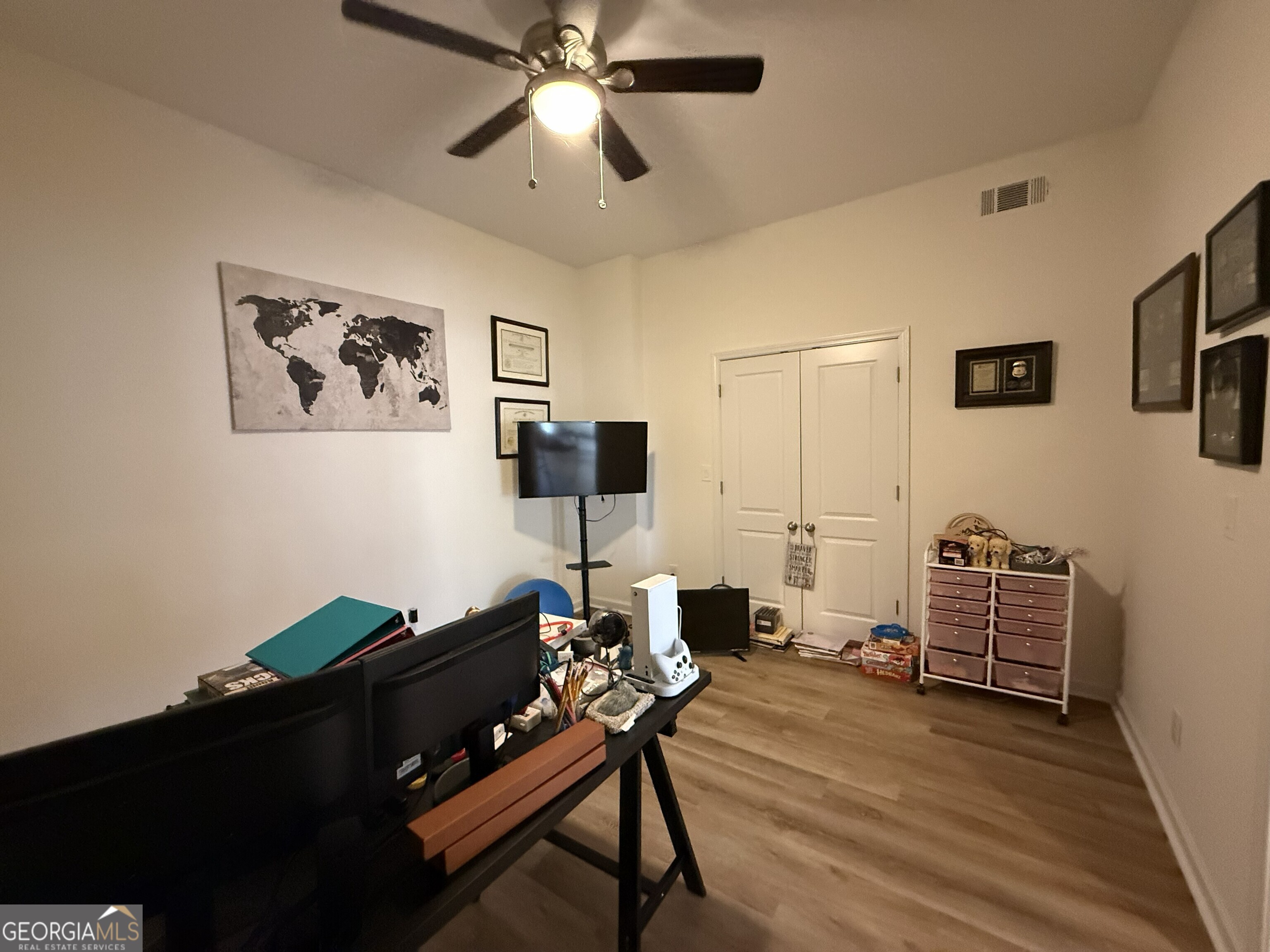990 Chateau Forest Road Hoschton, GA 30548 - Photo 53 of 117 a living room with furniture and wooden floor
