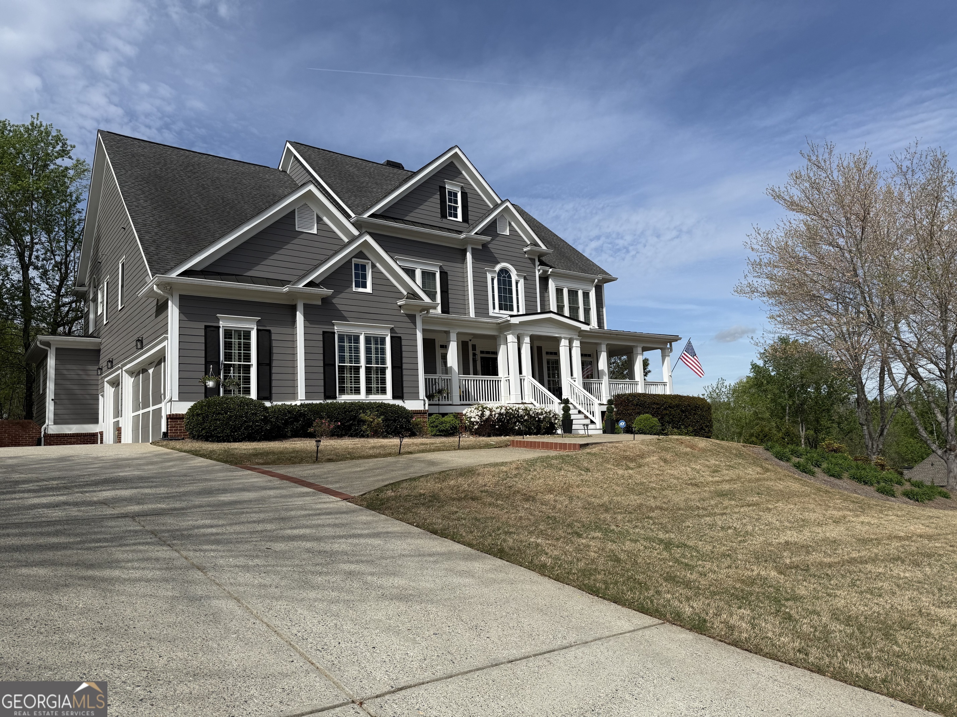 990 Chateau Forest Road Hoschton, GA 30548 - Photo 64 of 117 a front view of a house with yard and trees