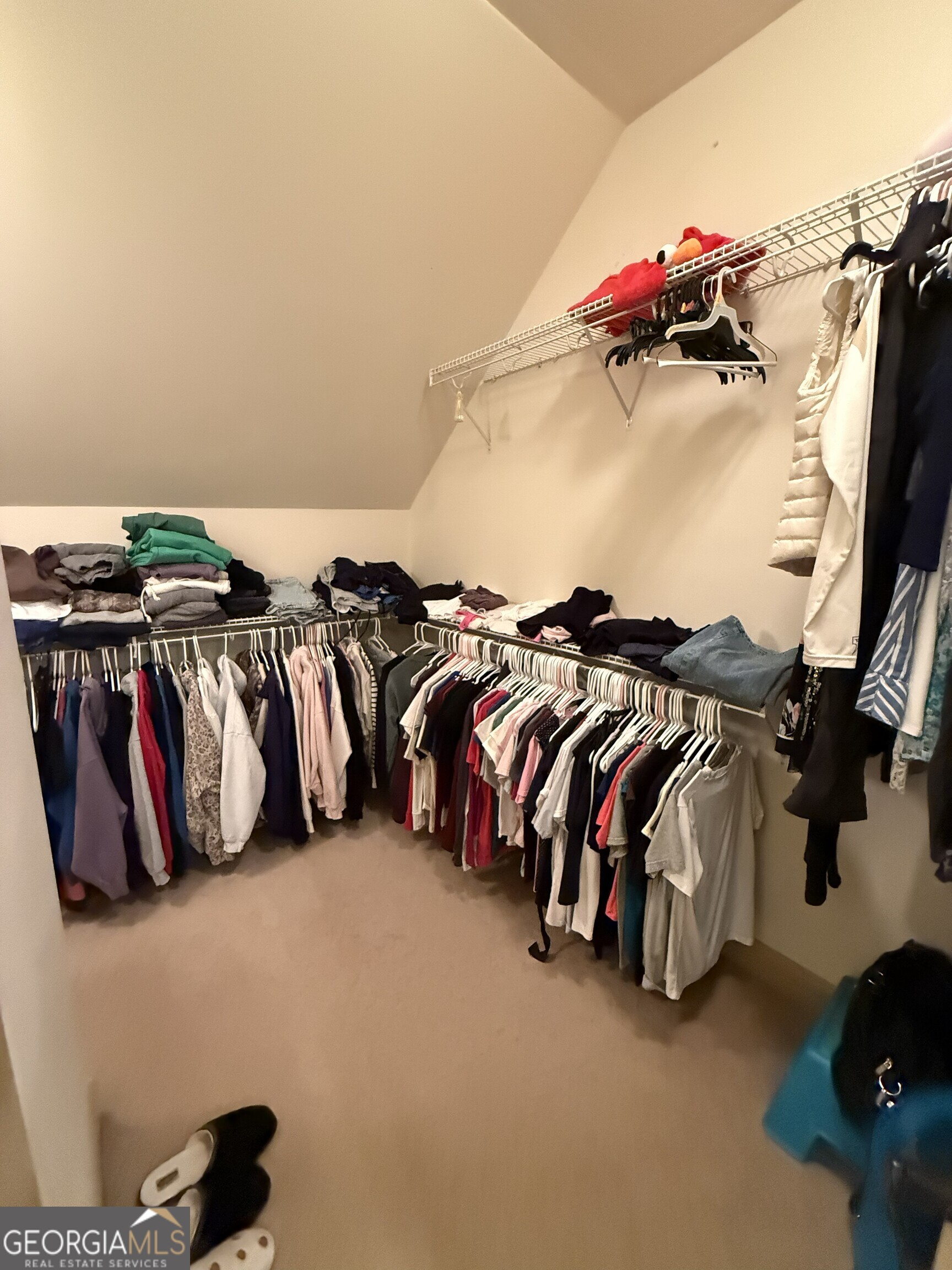 990 Chateau Forest Road Hoschton, GA 30548 - Photo 75 of 117 a view of walk in closet with clothes and shoes