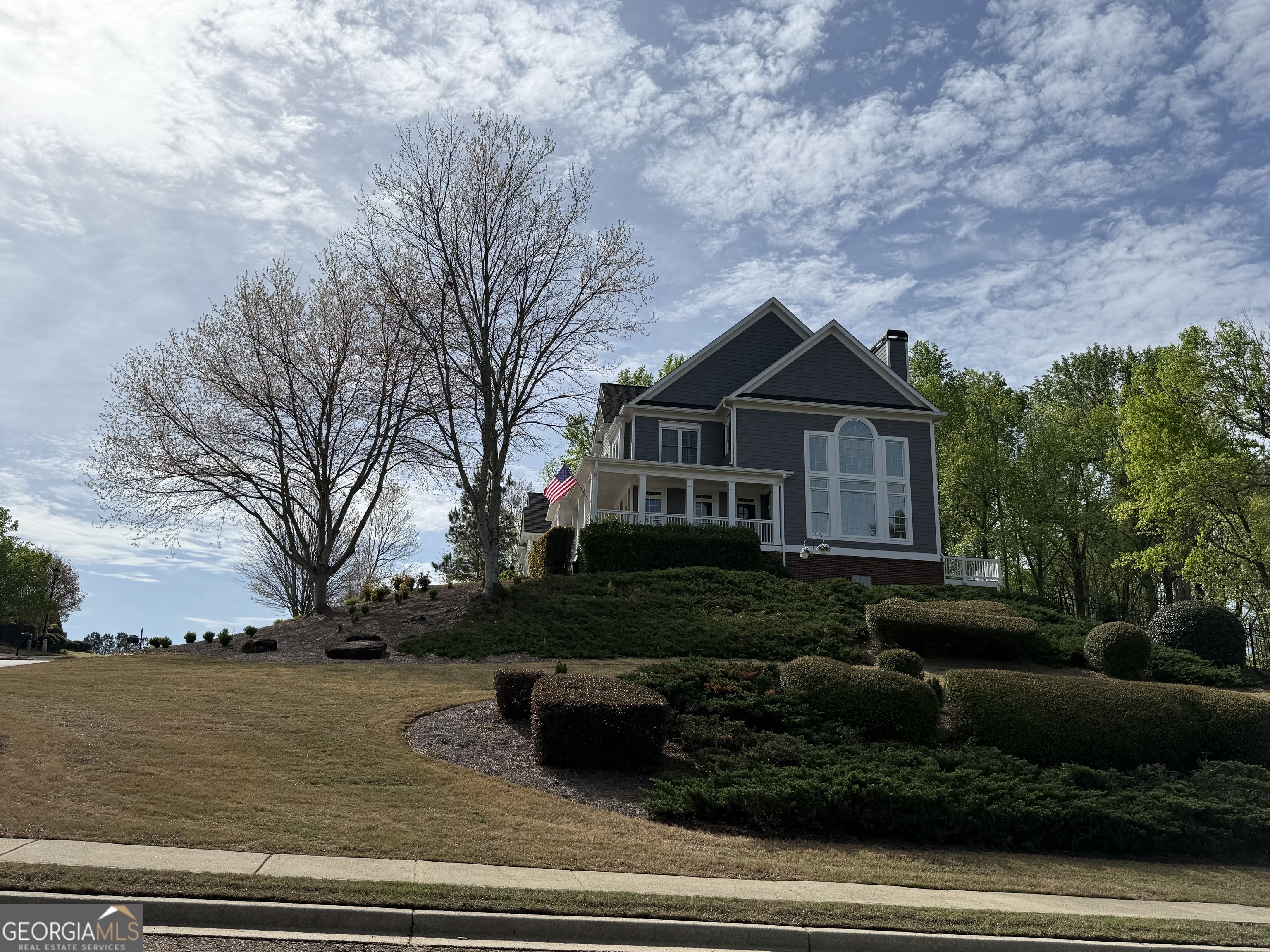 990 Chateau Forest Road Hoschton, GA 30548 - Photo 83 of 117 a front view of a house with a yard