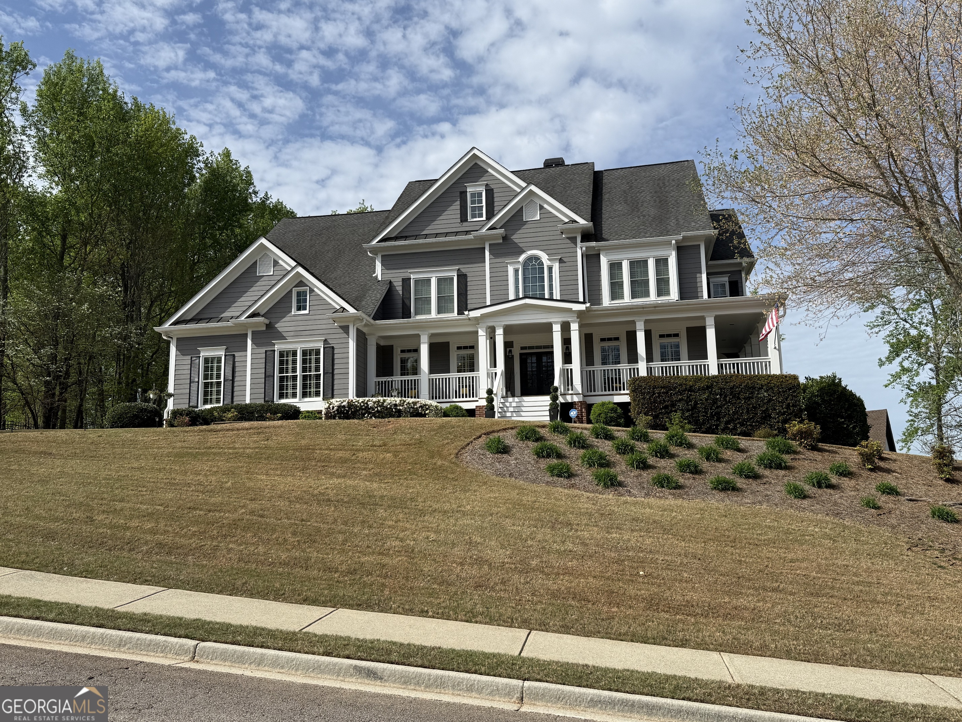 990 Chateau Forest Road Hoschton, GA 30548 - Photo 86 of 117 a front view of a house with a garden