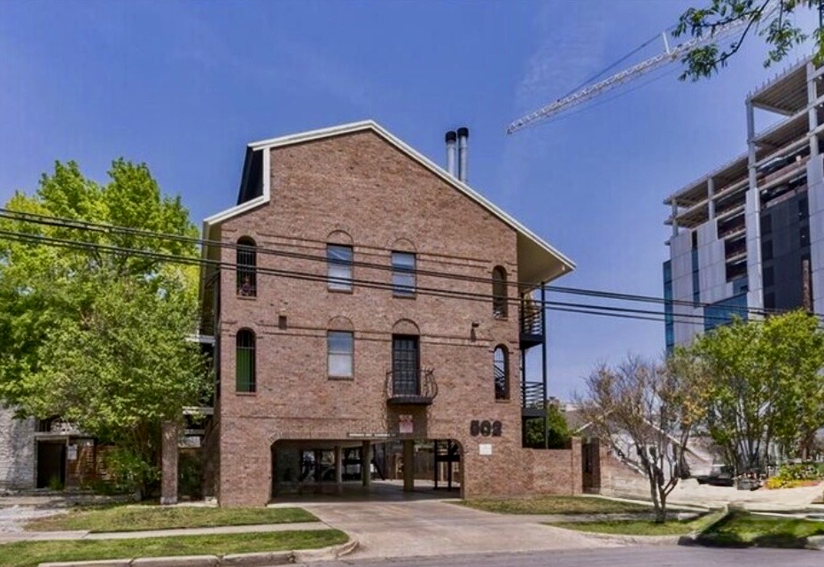 502 West 17th Street, Unit K Austin, TX 78701 - Photo 1 of 4 a front view of a house with a yard