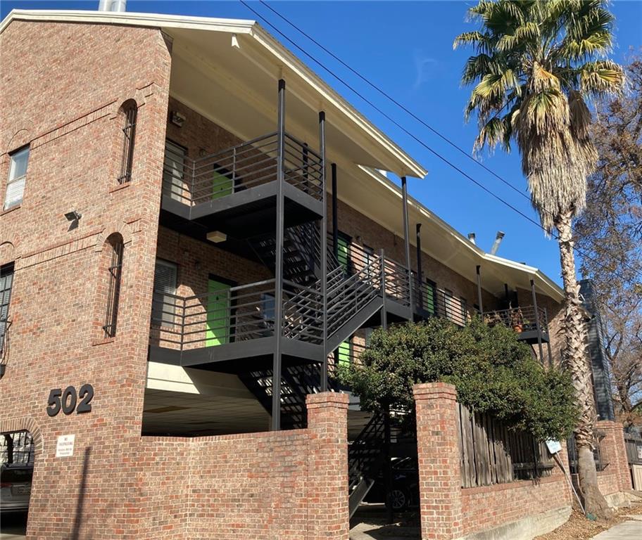 502 West 17th Street, Unit K Austin, TX 78701 - Photo 1 of 18 a front view of a house with a tree