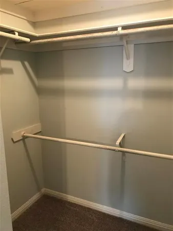 a bedroom with a bed and a fireplace