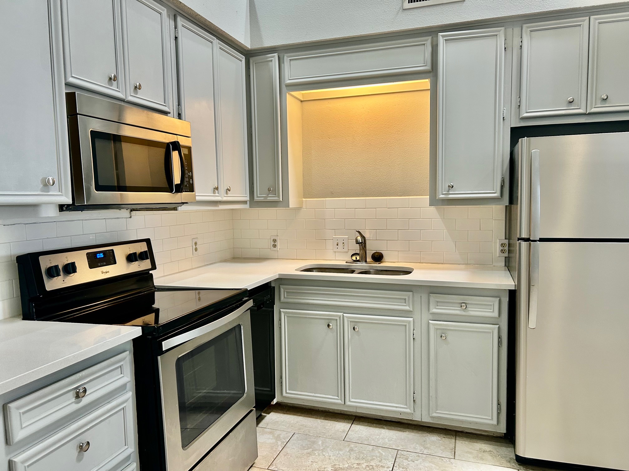 502 West 17th Street, Unit K Austin, TX 78701 - Photo 2 of 18 a kitchen with stainless steel appliances granite countertop a sink stove and microwave