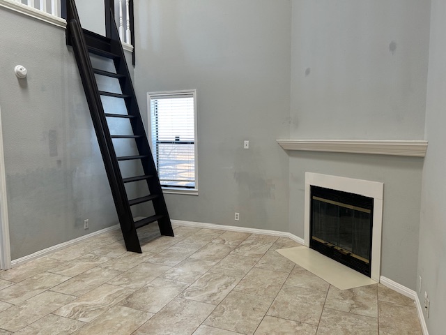 502 West 17th Street, Unit K Austin, TX 78701 - Photo 3 of 4 a view of a livingroom with wooden floor and fireplace