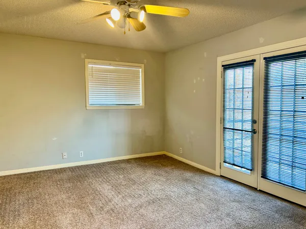a view of an empty room with a window