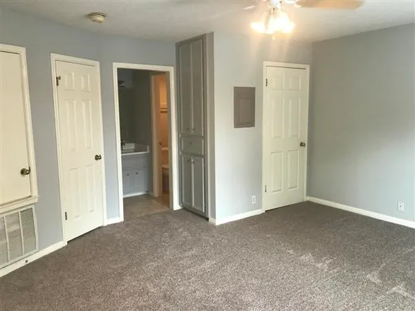 wooden floor and closet area in a room
