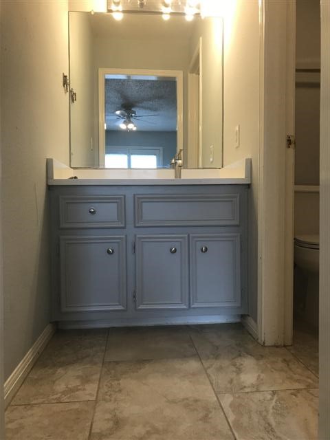 502 West 17th Street, Unit K Austin, TX 78701 - Photo 10 of 18 a bathroom with a sink and a mirror