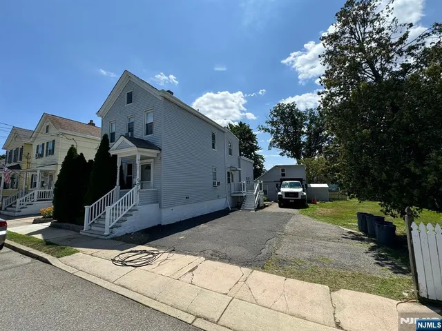 a view of a house with a sink and yard