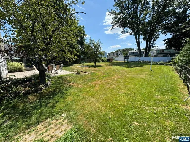 a view of a yard with swimming pool
