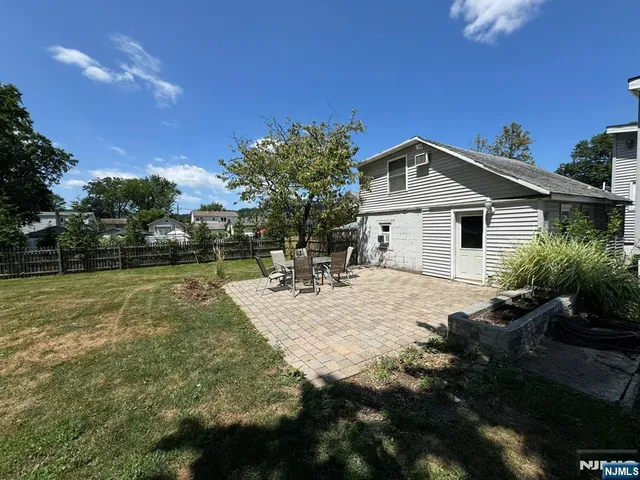 a view of a house with backyard porch and garden