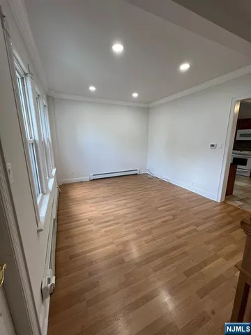 a view of an empty room with stairs