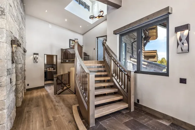 a view of entryway with furniture and wooden floor