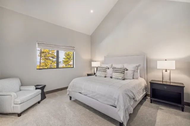 a bedroom with a bed and a couch