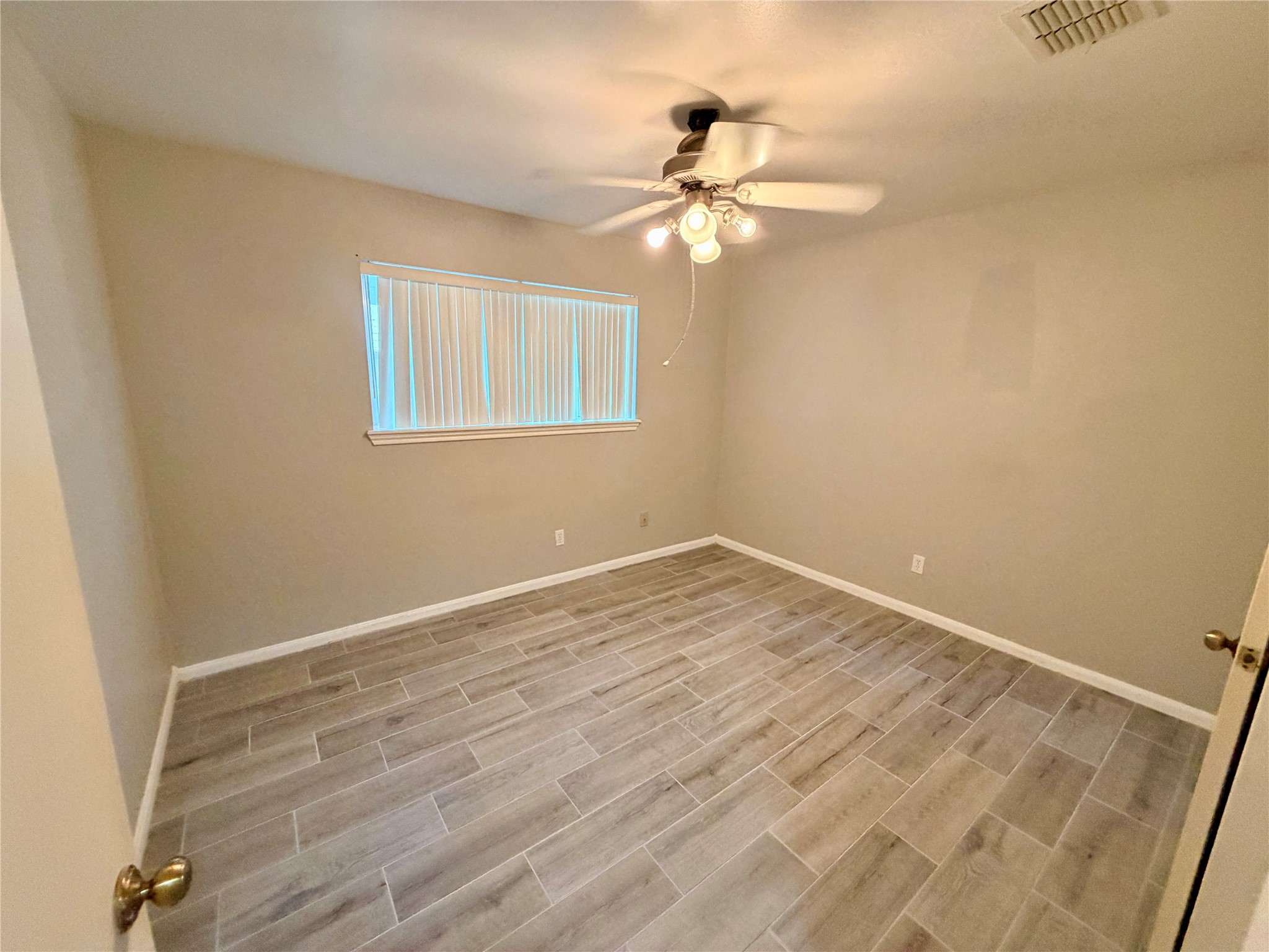 7876 Bender Road Humble, TX 77396 - Photo 22 of 28 a view of empty room with wooden floor