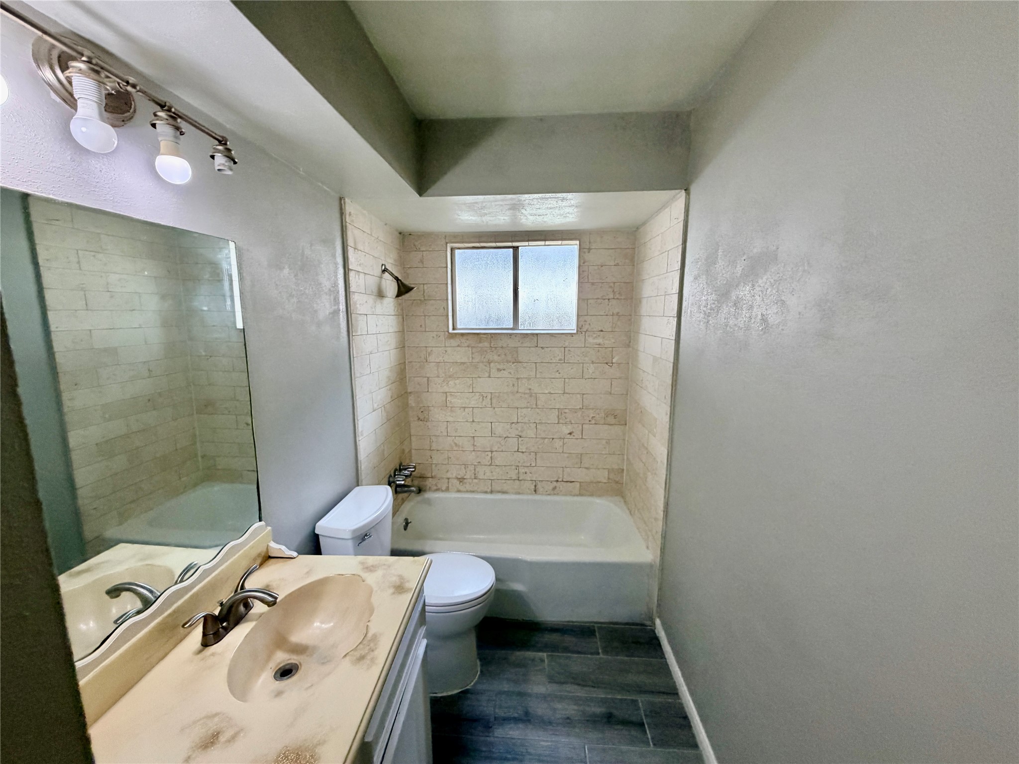 7876 Bender Road Humble, TX 77396 - Photo 24 of 28 a bathroom with a bathtub a sink and a shower