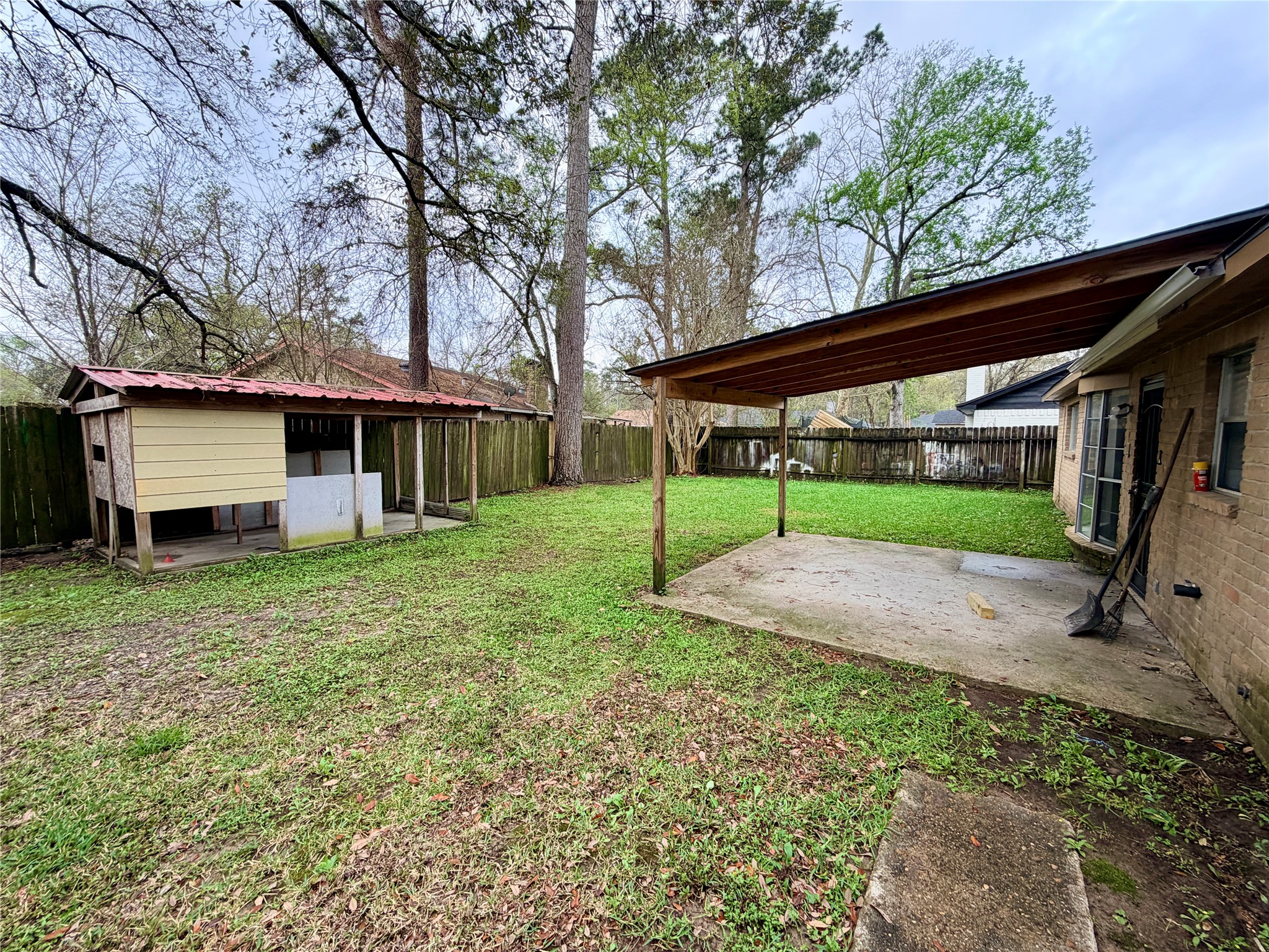 7876 Bender Road Humble, TX 77396 - Photo 27 of 28 a view of a house with backyard and trees