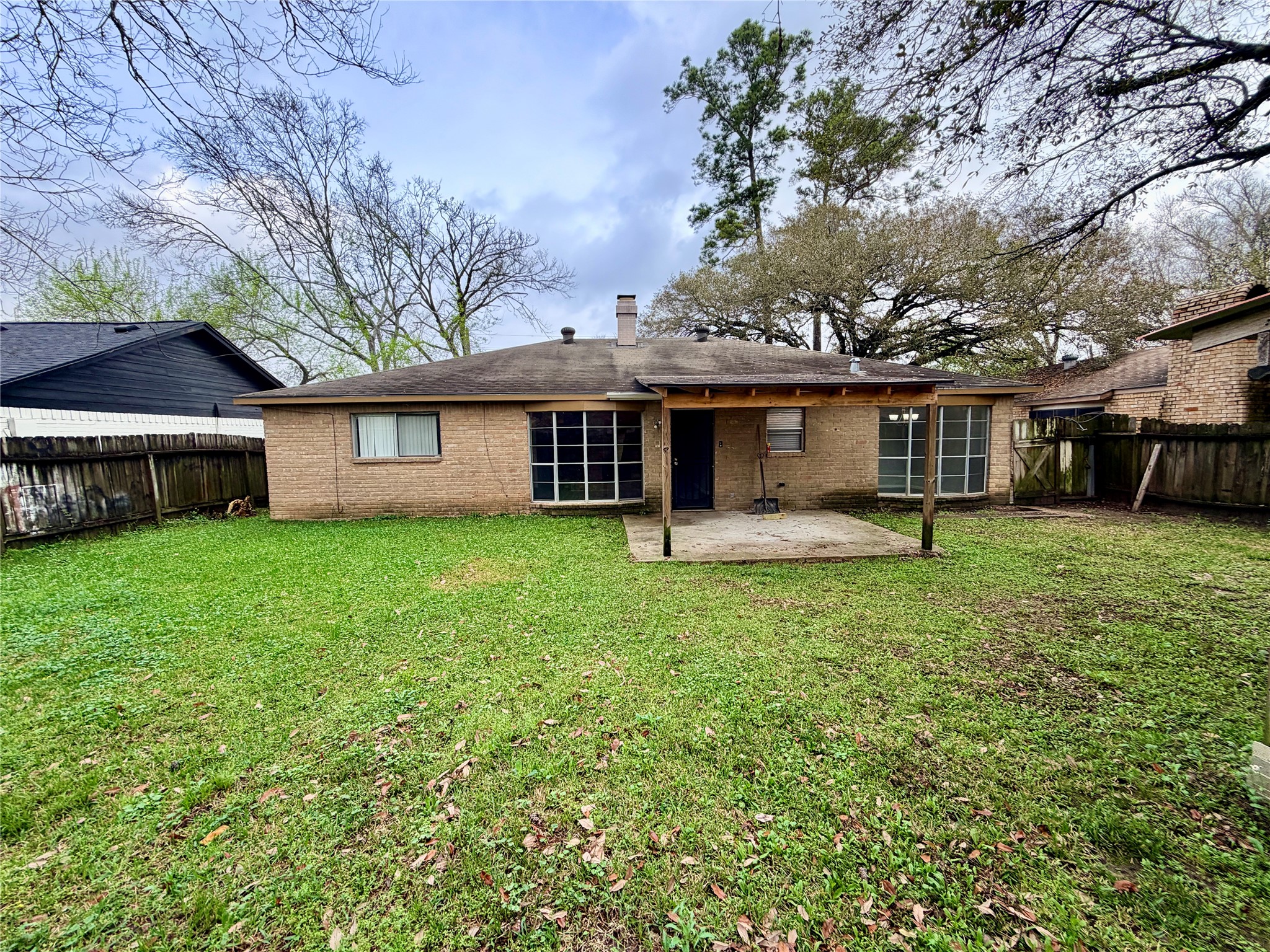 7876 Bender Road Humble, TX 77396 - Photo 28 of 28 a front view of a house with garden