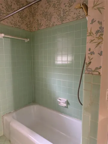 a bathroom with a bath tub