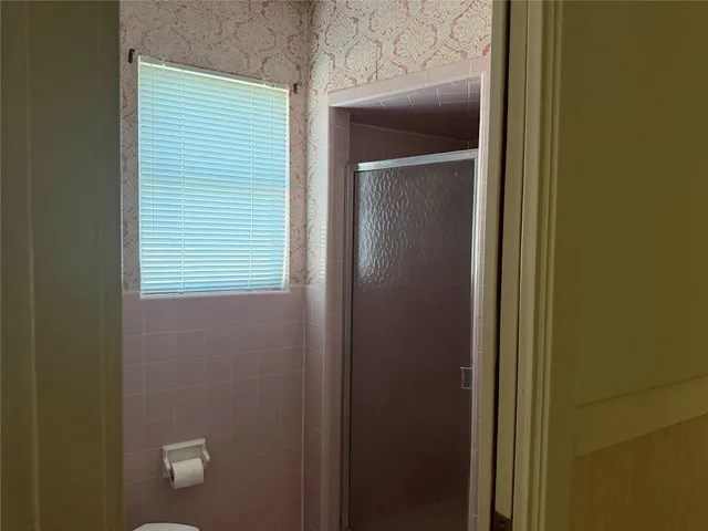 a view of a bathroom that has a window