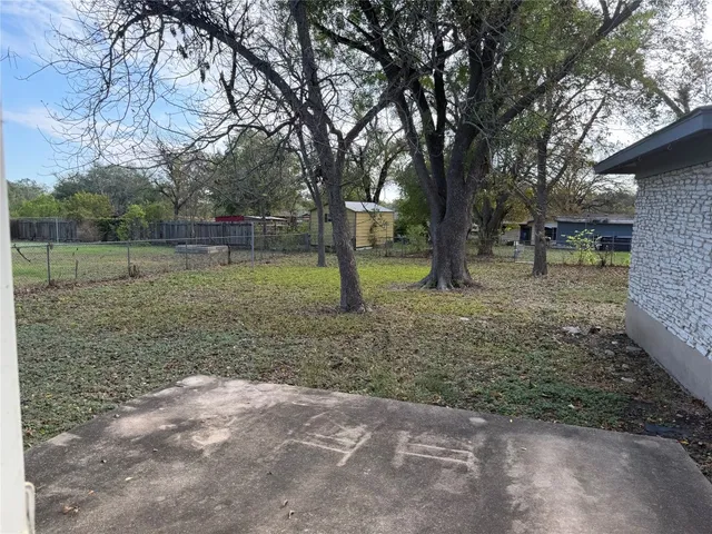 a backyard of a house with lots of green space