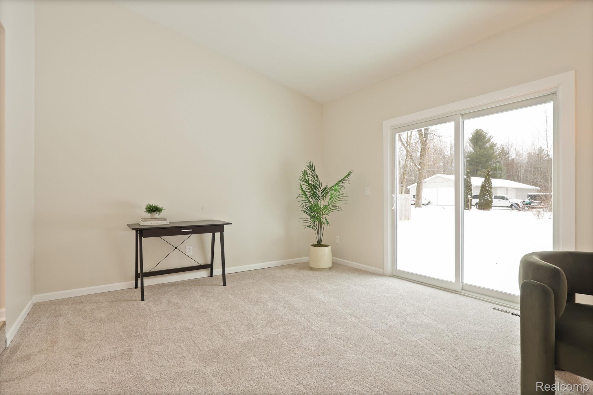 3937 Curtis Road Birch Run, MI 48415 - Photo 15 of 33 Living area with light colored carpet and baseboards