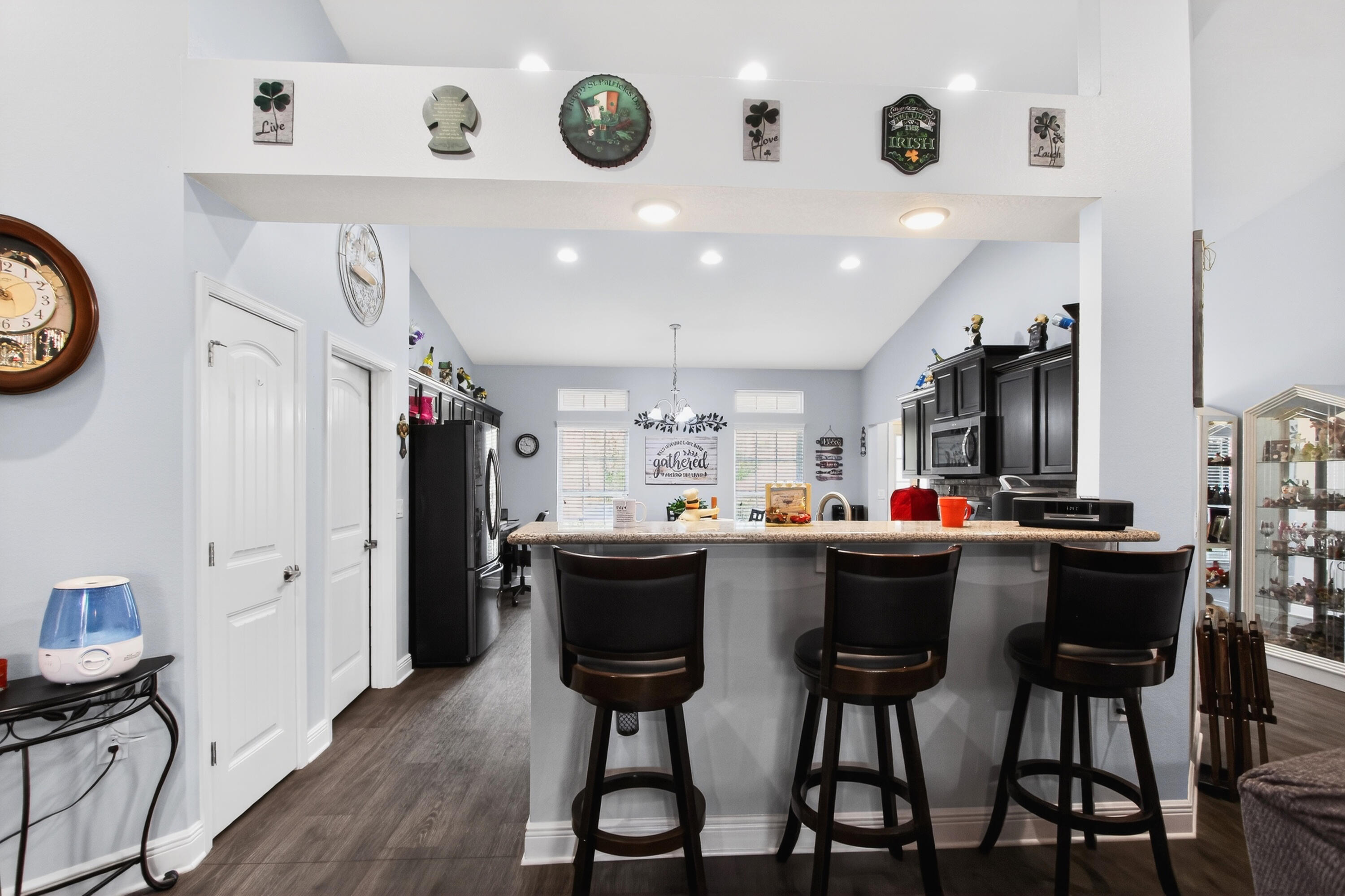 6317 Antigone Circle Crestview, FL 32536 - Photo 11 of 32 a kitchen with a dining table cabinets and stainless steel appliances