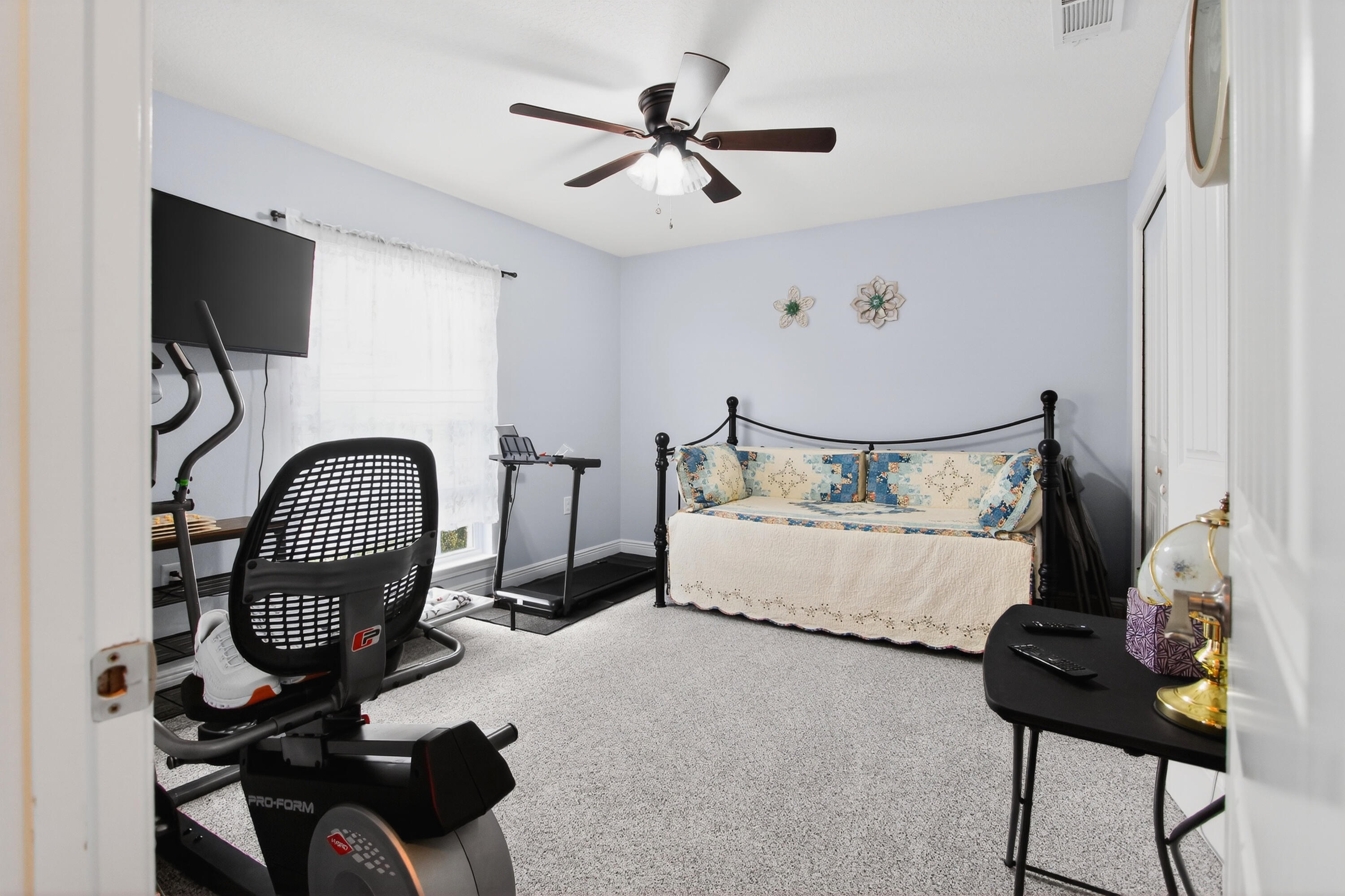 6317 Antigone Circle Crestview, FL 32536 - Photo 15 of 32 a bedroom with bed and a chandelier
