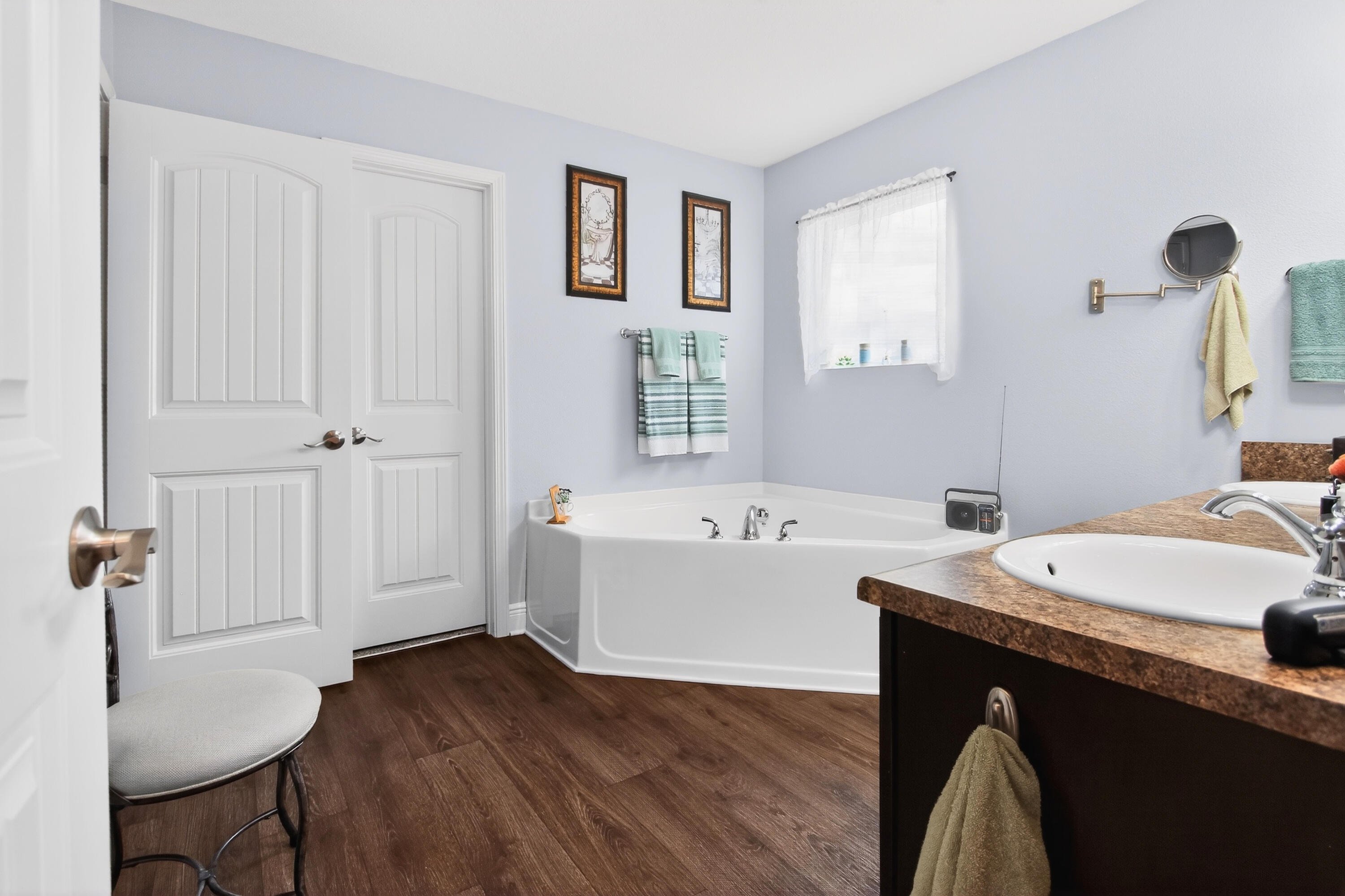 6317 Antigone Circle Crestview, FL 32536 - Photo 18 of 32 a bathroom with a sink a bathtub and a mirror