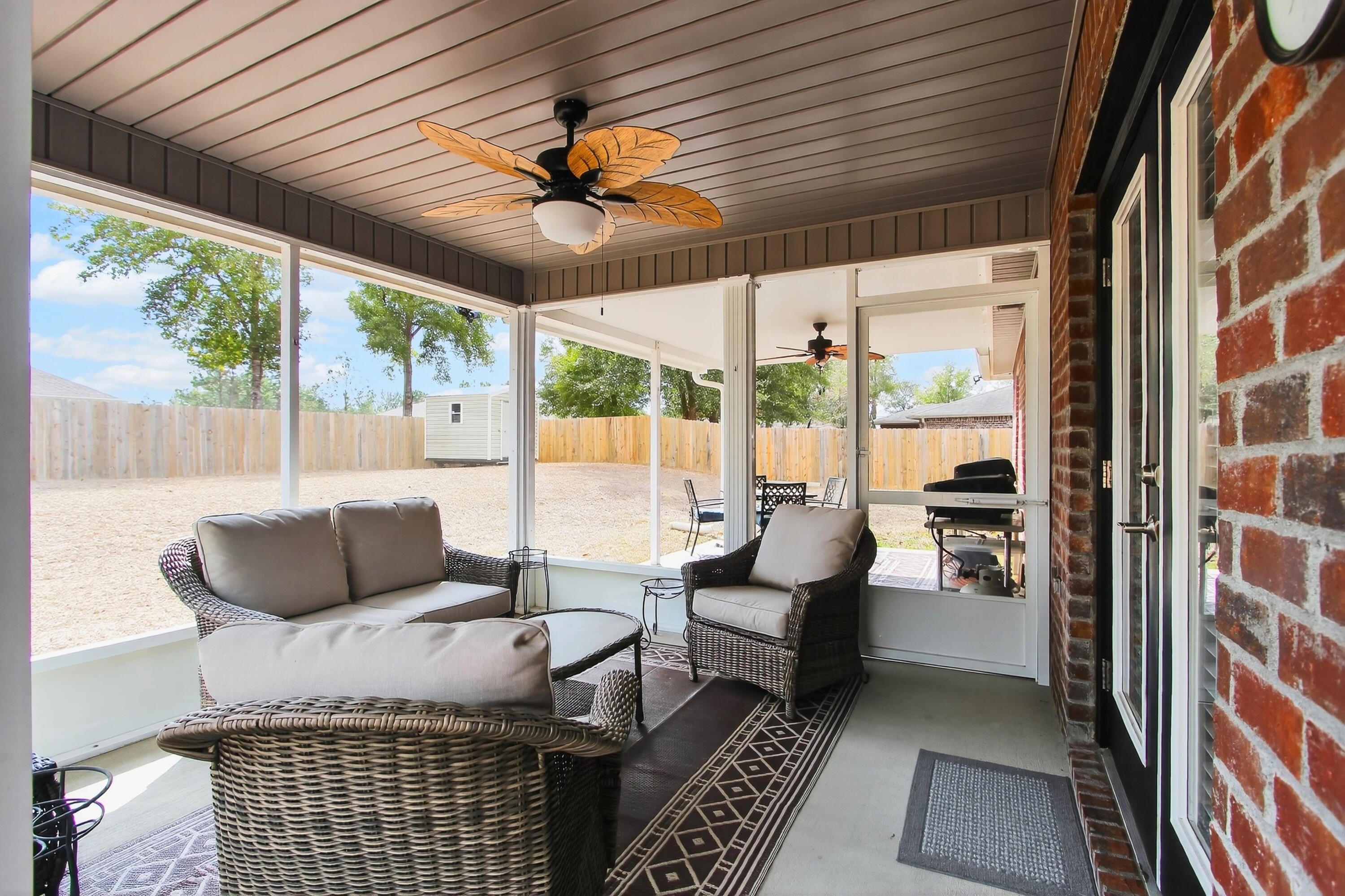 6317 Antigone Circle Crestview, FL 32536 - Photo 28 of 32 a living room with furniture and a large window