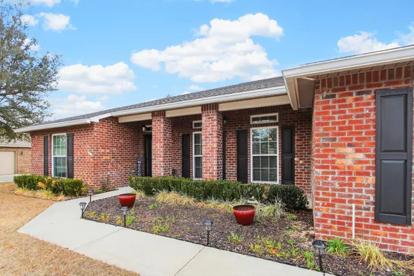 a front view of a house with yard